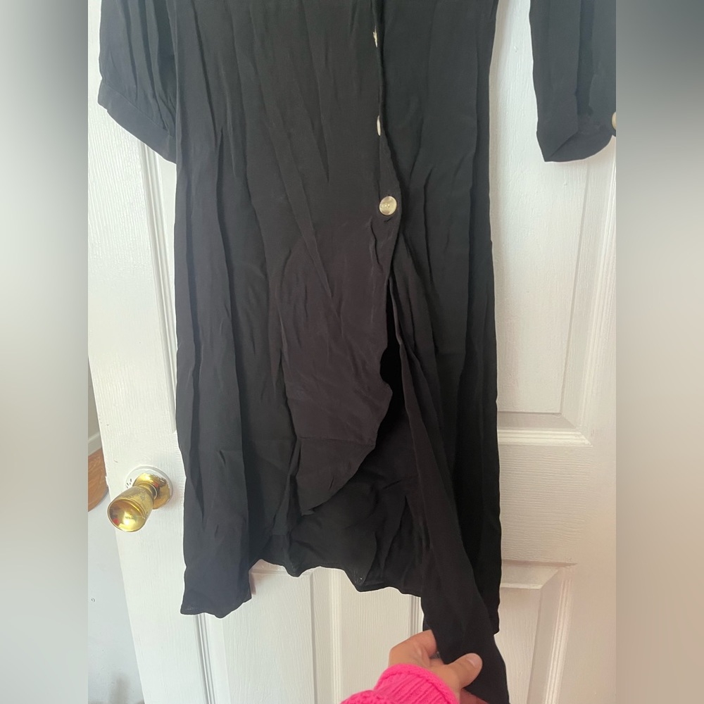 Asymmetrical black dress, with button design